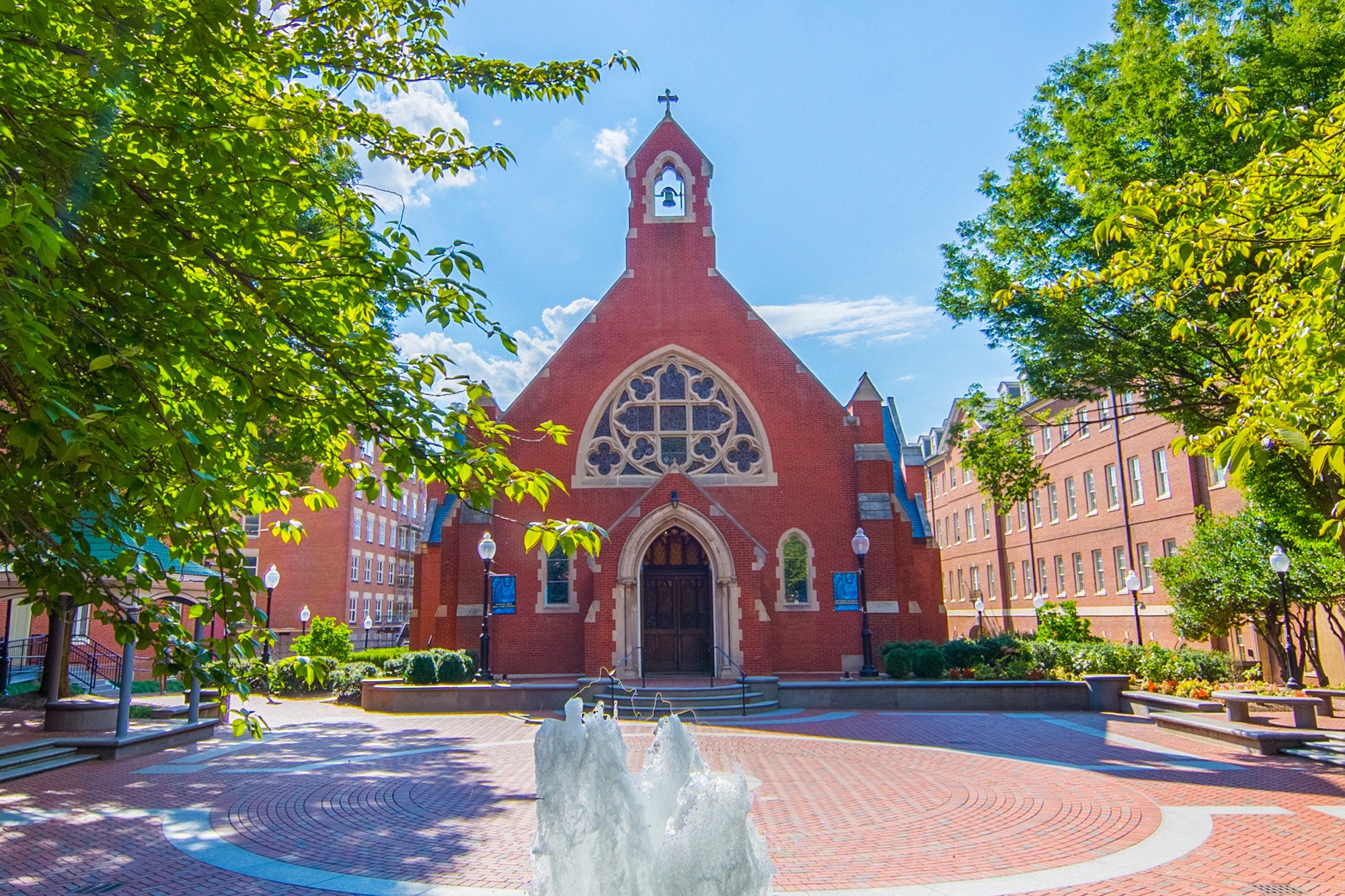 A fountain bubbles in front of Dahlgren Chapel.