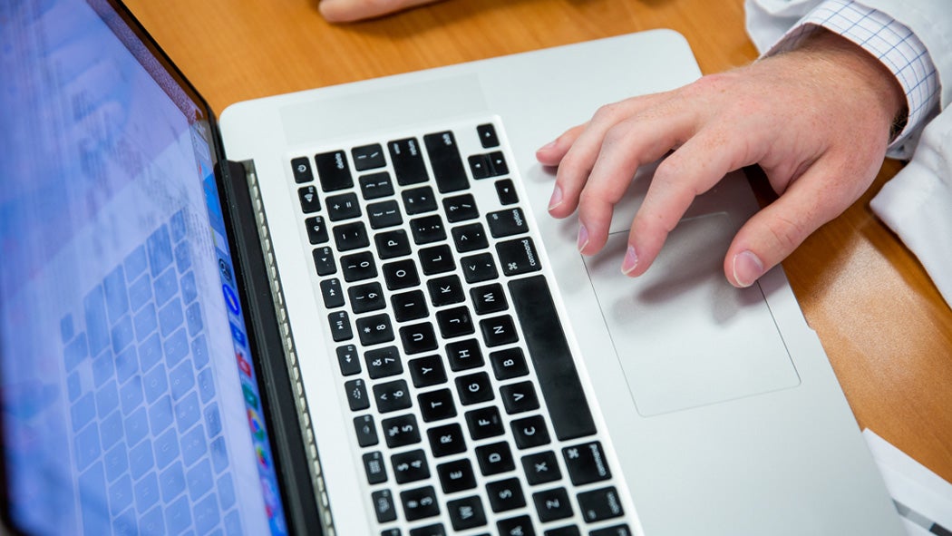 A student uses a laptop.