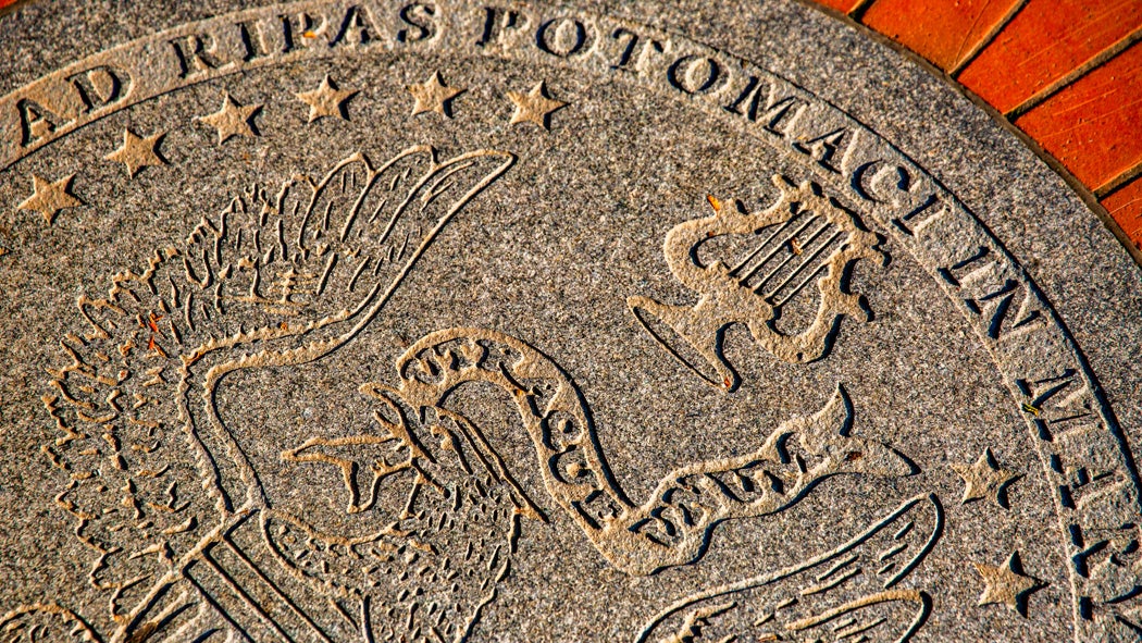 A stone version of the Georgetown University seal inlaid within bricks in Dahlgren Quad.