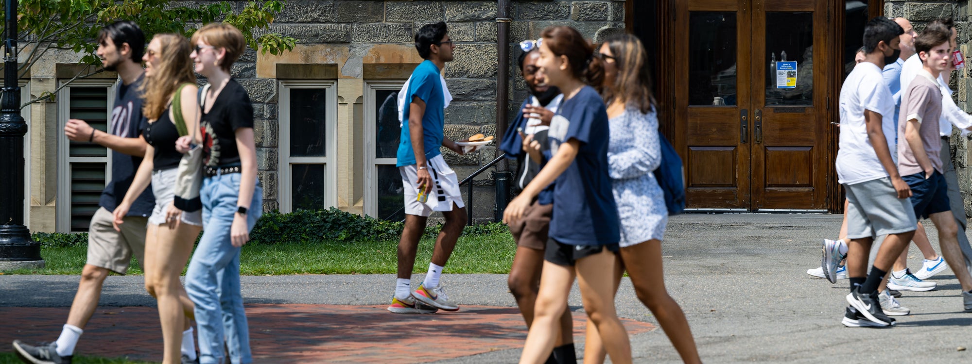 Students walk past Healy Hall on the front lawn of Georgetown's campus.